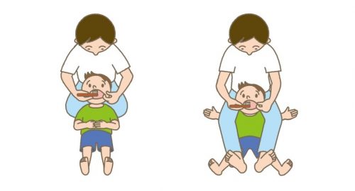 Clip art of father brushing his child's teeth.